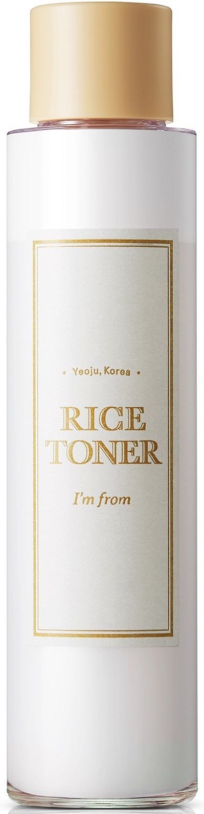 En lång vit flaska med guldkork, märkt 'Rice Toner' från Korea, enkel design.