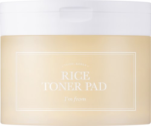 En beholder til ris toner pads, primært beige med hvid låg, mærkenavn og produktbeskrivelse på forsiden.