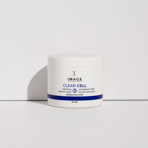 A white jar of skincare cream with blue and black text, labeled 'Clear Cell' and 'Salicylic Acid' for acne.