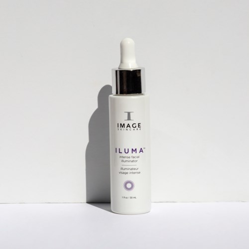 White bottle with a dropper cap, labeled "ILUMA" face serum, from Image Skincare.