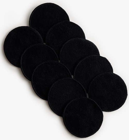 Eight black circular pads arranged in a cluster, likely adhesive or protective pads.