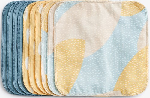Colorful cloth wipes with soft patterns, stacked in two piles, mostly yellow and blue. Suitable for baby care or cleaning.