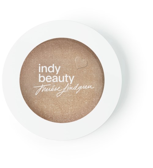En rund beholder med beige pulver og ordene: 'indy beauty' og 'thúres yndgren' i hvitt.