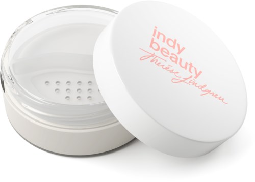En rund behållare med lock, märkt "indie beauty" och "Theaeyse Lindegren," troligen en makeup- eller hudvårdsprodukt.