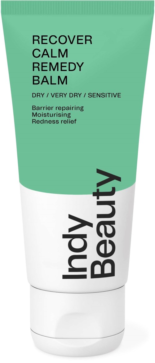 Vihreä ja valkoinen putkilopakkaus, jossa lukee "Indy Beauty Recover Calm Remedy Balm" erittäin kuivalle iholle, sisältäen parantavia ainesosia.