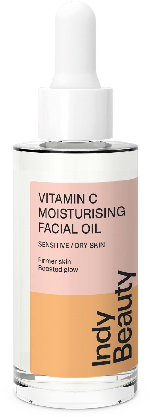 En ansiktsolje flaska märkt 'Vitamin C Moisturising Facial Oil' för känslig hud, från Indy Beauty, i rosa och orange färger.