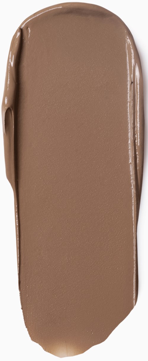 A smear of brown cream, smooth and elongated, likely a swatch of makeup or chocolate.