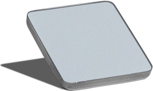 En grå fyrkantig låda med rundade kanter som verkar vara en liten elektronisk apparat, skuggas.