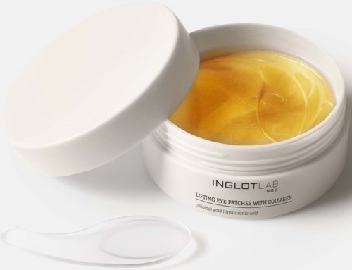 Biały słoik Inglot lab podnoszących podków pod oczy z złotym żelem i szpatułką.