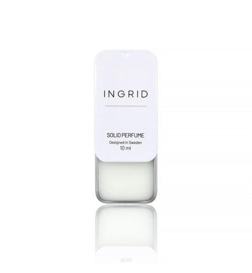 Klein wit parfumflesje met witte dop en eenvoudige label die zegt "INGRID" en "Solid Perfume."