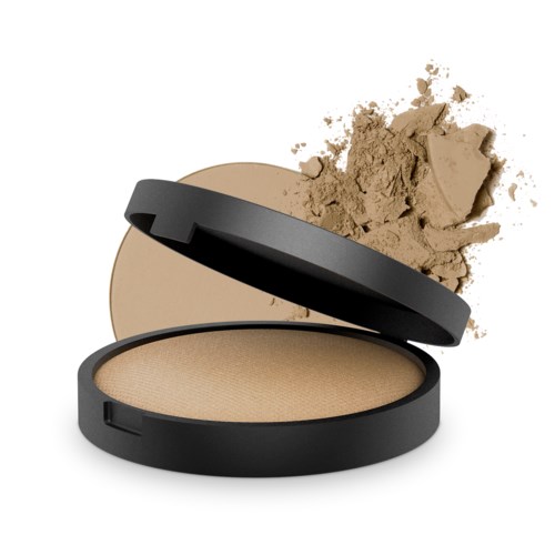 En liten beige puder i ett svart runt fack med lite puder utspillt.
