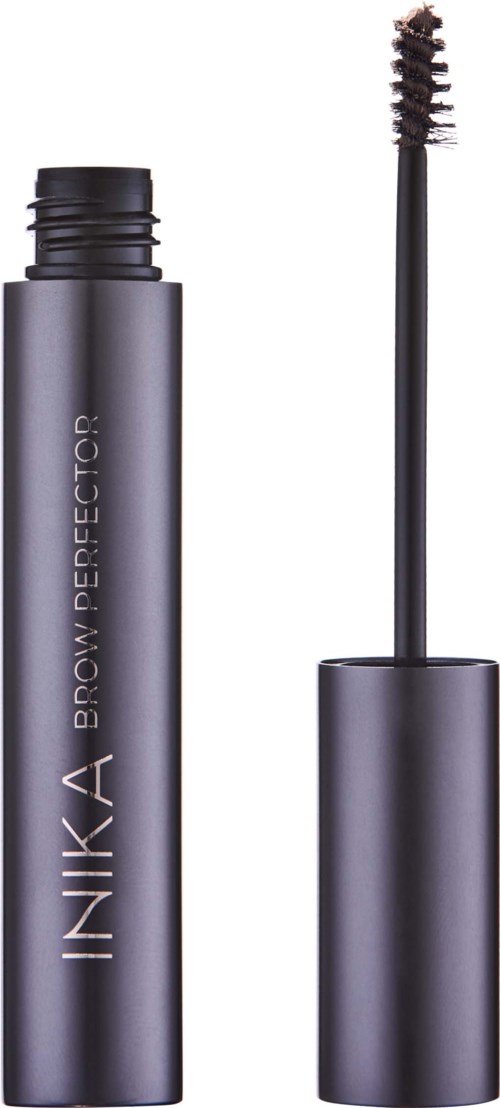 En grå mascara tubes med en borste bredvid. Borsten har en snurrad borste, och tuben har orden "INKA BROW PERFEKTOR".