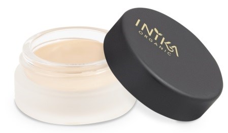En liten rund burk med grädde och ett svart lock med guldtext som säger 'INKA Organic'.