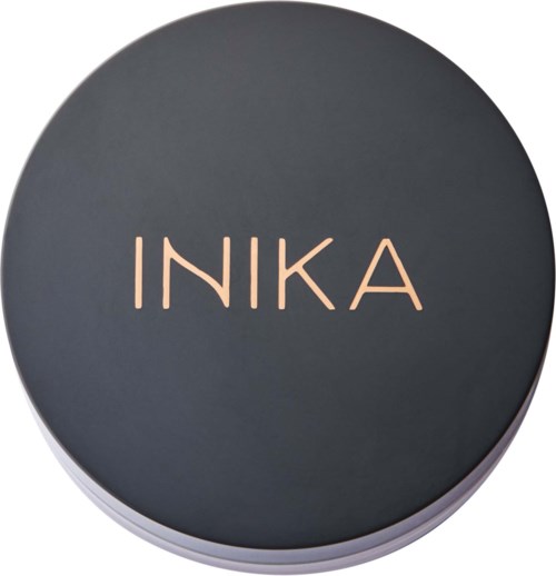 Runde Dose mit dunklem Deckel und dem Wort INIKA in rosa Buchstaben.