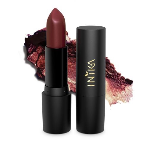 A lipstick with a dark pink shade against a background of a smudged pink makeup, with a black container and gold text.