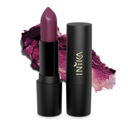 A pink lipstick in a black tube with the lipstick out, and a pink powder smear in the background.