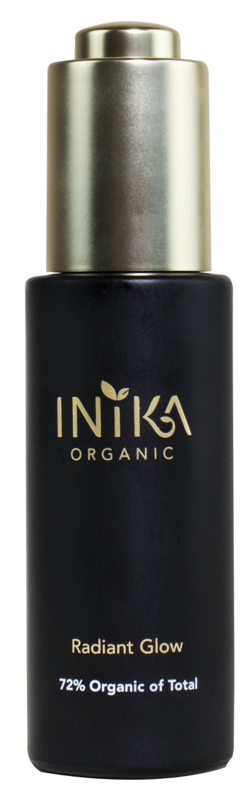 A black bottle with gold cap and label showing 'Inika Organic Radiant Glow' and '72% Organic'.