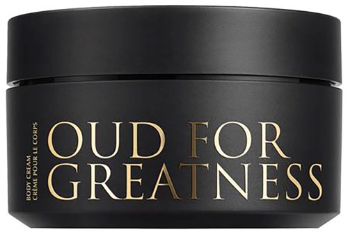 A black jar with gold text that says "Oud for Greatness" and is a body cream container.