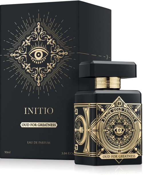 A black perfume bottle with gold design and eye symbol, and matching box with similar gold pattern and eye symbol.
