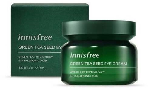 A green jar of Innisfree Green Tea Seed Eye Cream with a matching box behind it.