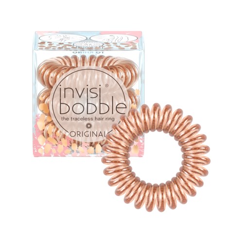 En roséguldfärgad hårbindare i genomskinlig förpackning med rosa detaljer, formad som en spiral. Texten på etiketten är "invisiDObble."