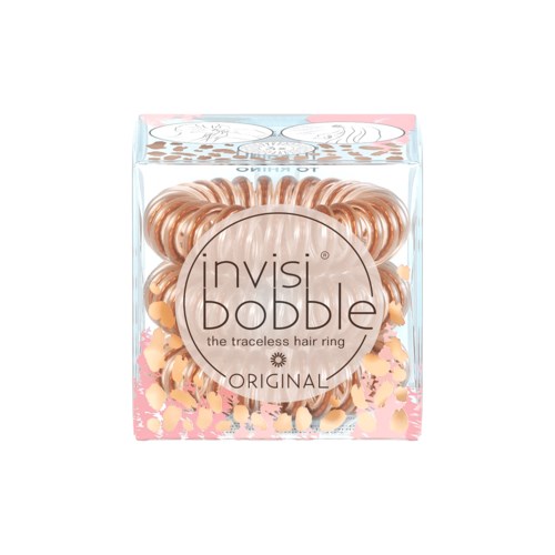 Ett genomskinligt paket innehåller hårsnoddar kallade Invisibobble, med rosa och guld delar, och märkningen på framsidan.