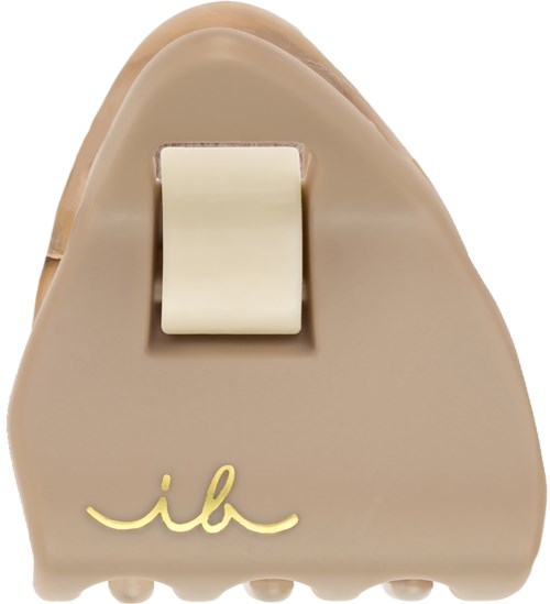 Een beige prothesevoet met een witte hakkap en een gele handtekeninglogo. Gladde oppervlakte en ronde vorm.