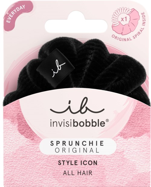 Svart hårsnodd i förpackningen, märkt som 'invisibobble' för alla hårtyper, med rosa och vit design.