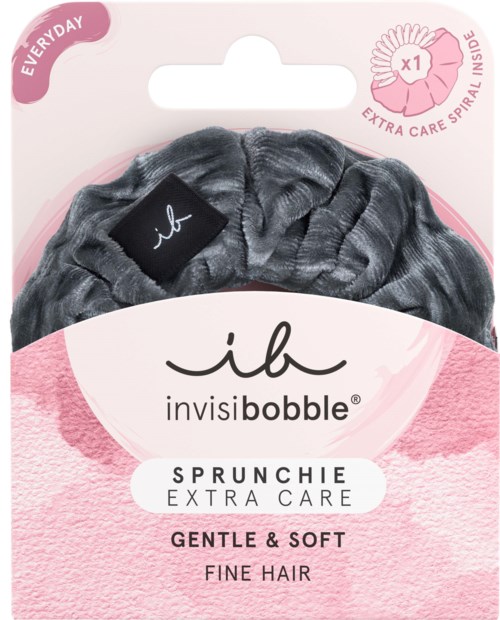 Blødt, mørkegråt hårbånd med lille sort logo, mærket til ekstra pleje, egnet til skrøbeligt og fint hår.