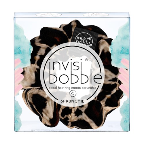 Bilden visar en låda med ett hårband som ser ut som djurprint, märkt 'invisi bobble'.