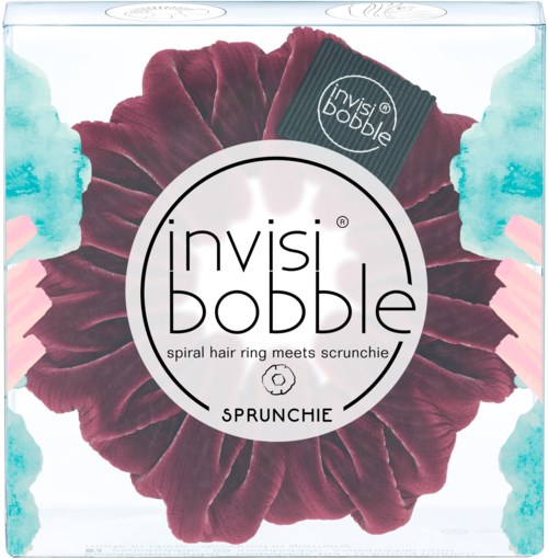 En cirkulär hårdutt av burgundy färg med en scrunchie inuti, märkt 'invisibobble' och 'SPRUNCHIE' i en låda.