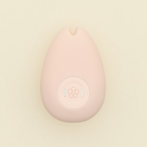En rosa elektronisk enhet formet som et lite egg med knapper og et blomsterdesign på.