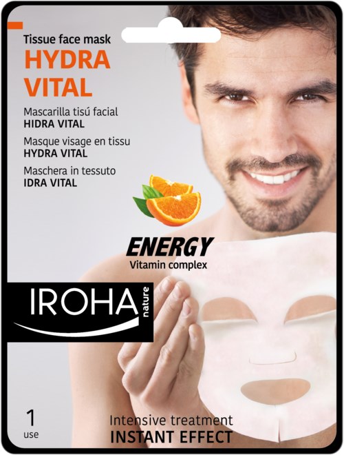 En leende man håller i ett paket med ansiktsmask. Paketet säger 'HYDRA VITAL' och nämner vitaminkomplex och energi. Oslo-märke.