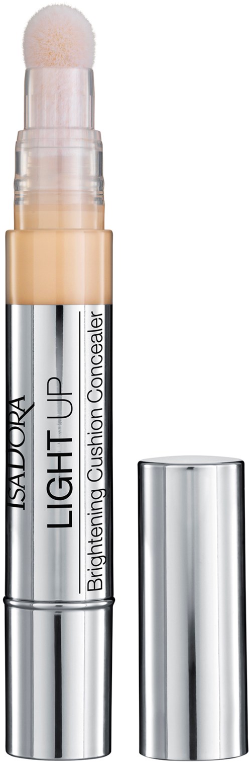 En ljusgörande concealer-sticka med vit och silver design, märkt "Isadora Light Up Brightening Cushion Gushion Concealer."