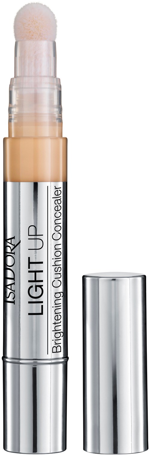 En concealer-sticka med en vit borste, märkt 'Isadora Light It Up,' i silver- och beige färger.