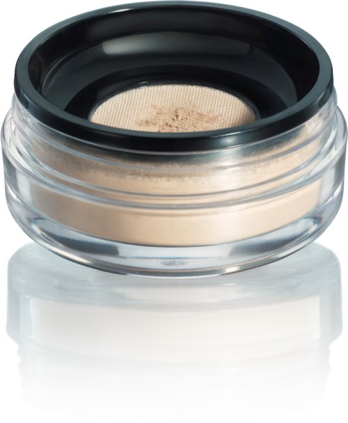 En liten rund behållare med beige makeup inuti och ett svart lock, troligen för kosmetika eller ögonskugga.