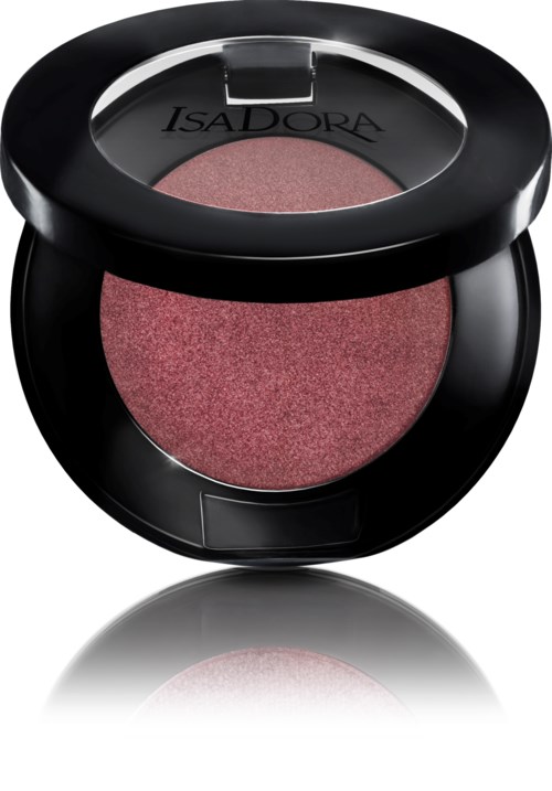 En rund makeuppåse med rosa ögonskugga inuti och ett tydligt lock som visar varumärket Isadora.