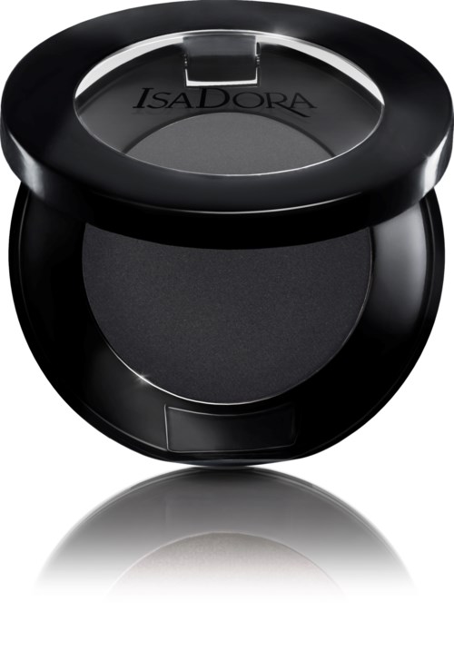 En liten rund behållare med ett svart lock, märkt 'ISADORA', verkar vara en kosmetisk produkt eller sminkkompakt.