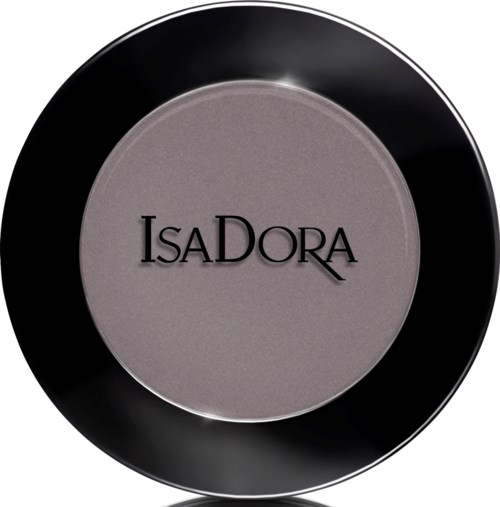 En rund svart sminkkompakt med grått puder och märket IsaDora på.