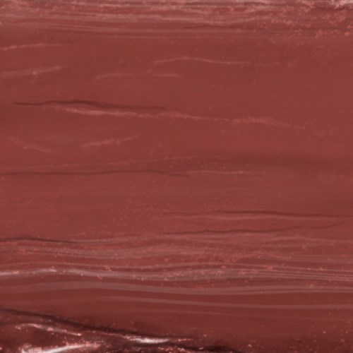 Bilden visar en närbild av en röd, texturerad yta, möjligen trä eller sten med naturliga linjer och mönster.