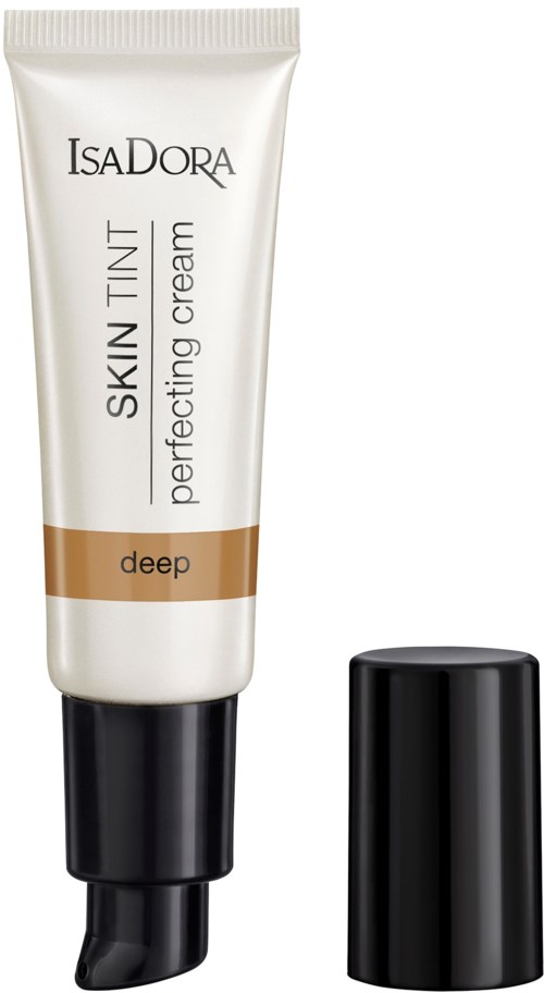 En vit tub med IsaDora Skin Tint Perfecting Cream med svart lock bredvid.