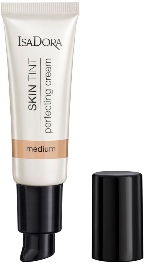 En tub märkt 'IsaDora Skin Tint Perfecting Cream' i medium nyans, med svart lock bredvid.