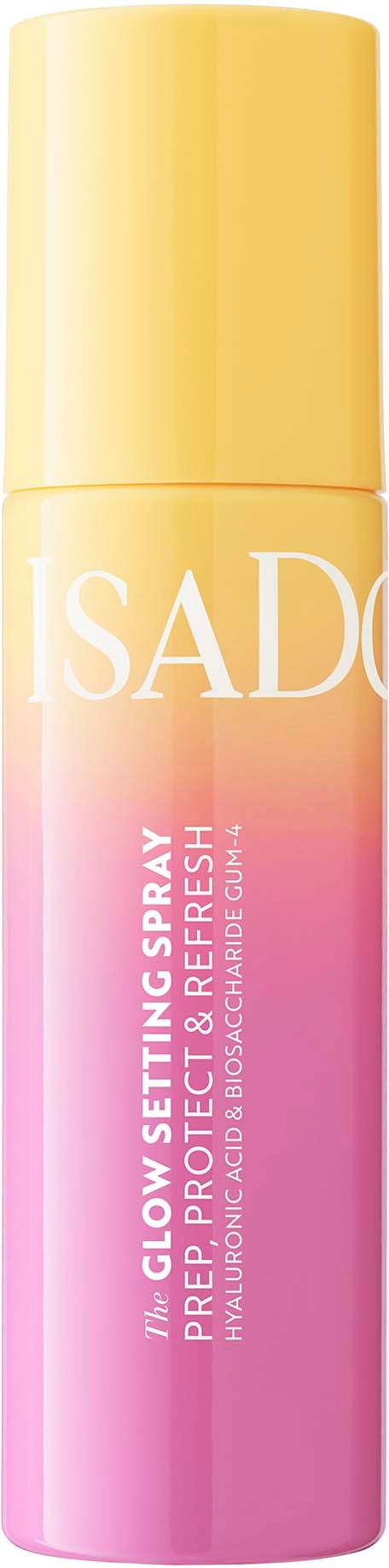 Suihketölkki keltaisella kannella ja pinkillä rungolla, merkinnällä 'ISAD' ja 'Glow Setting Spray' raikkaaseen hehkuun.