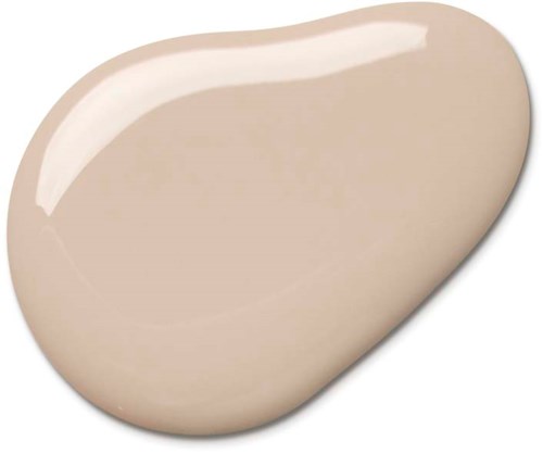 Beige, sileä, soikea esine kiiltävällä pinnalla, mahdollisesti saippua tai kivi.