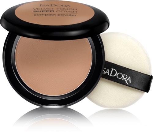 Ett kompakt puder med beige nyans, följt av en rund puff applicator märkt PrettyDora.