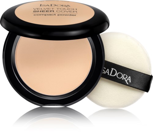 Ett kompakt puder i beige nyans med en rund svamp applicator med svart band märkt 'IsaDora'.