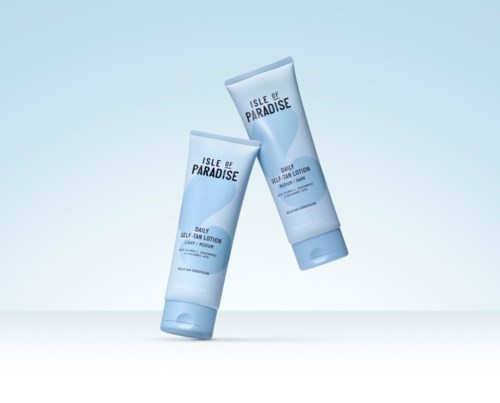 Two tubes of Isle of Paradise Daily Self-Tan Lotion float with a light blue background.