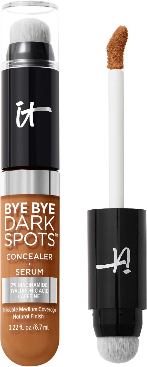 En concealerstift merket 'Bye Bye Dark Spots' med en svampapplikator ved siden av.