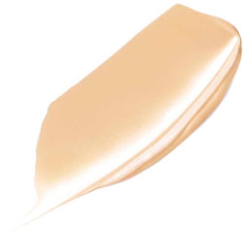 Kremaktig beige foundation strøket på en hvit bakgrunn.