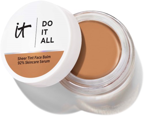 Åpen krukke med beige ansiktsbalm og hvit lokk som viser merket it DO IT ALL og beskrivelsen Sheer Tint Face Balm.